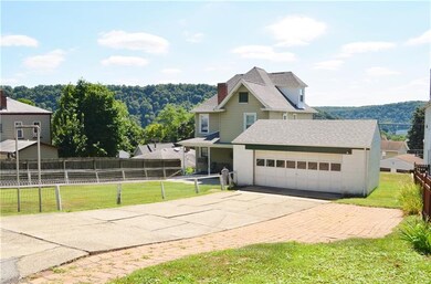 Paved drive to attached garage with rare off stree