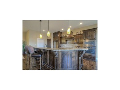 Kitchen with a raised island. Enough room for 6 ba