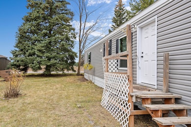 Entry featuring yard with mature trees