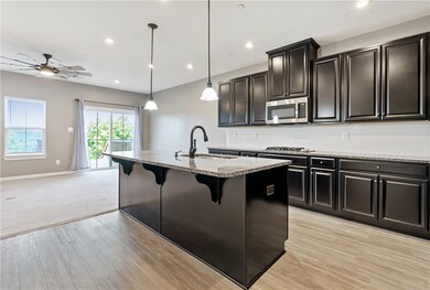 Granite topped island matches the granite counters
