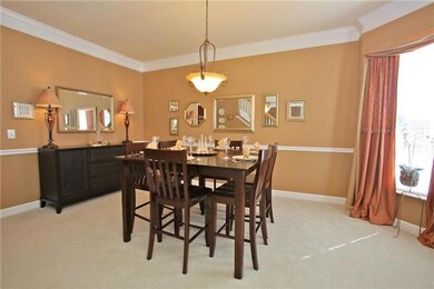 Formal dining room that has easy flow for entertaining the upcoming holidays. Crown molding and chair rail highlight this beautiful room.