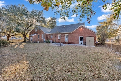 Rear view of property featuring a patio area and a
