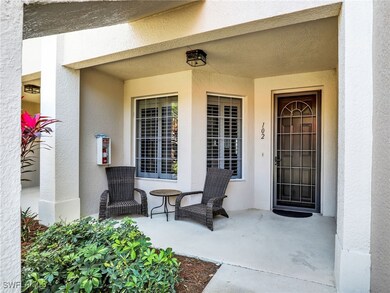 Entrance to property with stucco siding