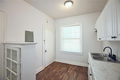 Washroom featuring dark wood finished floors and electric panel