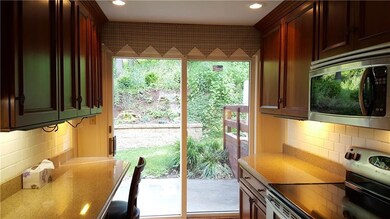 View of sliding door to back patio highlighting be