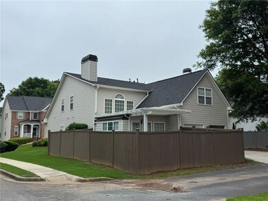 View of property exterior with a pergola and a chimney