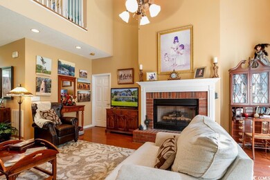 Living room with hardwood / wood-style flooring, a