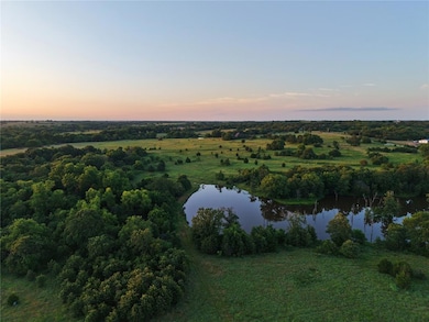 Aerial overview of property's location with a large body of water