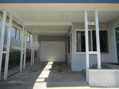 Covered Carport, Converted Garage and Front Entry
