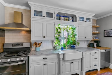 Front to back kitchen and dining with gas burning fireplace and window seat.