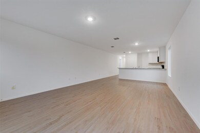 Unfurnished living room with light wood-type floor