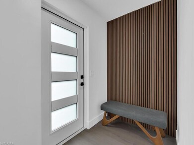Doorway to outside featuring hardwood / wood-style