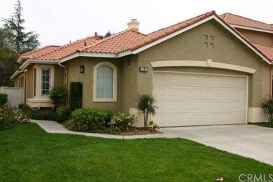 Front of home, entry is on the left (east) side