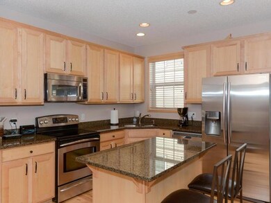 Maple cabinets, center island, surround and stainl