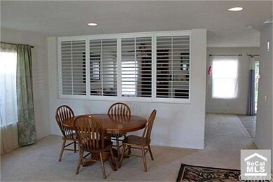 Dining room with open shutters.