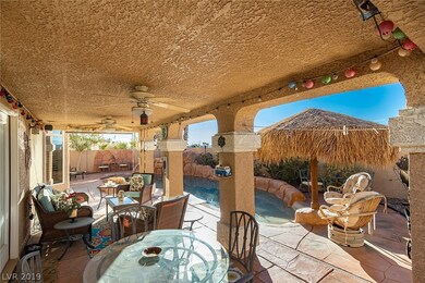 Covered patio with outdoor fans, palapa, and tropi