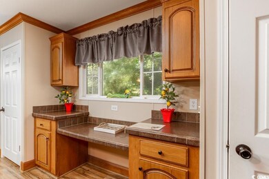 Kitchen with light wood-type flooring, a healthy a