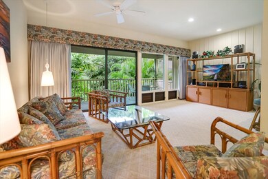 Tall ceilings and lots of windowf make the great room/living look bright and happy