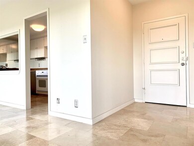 Entry hall of condo from building corridor.