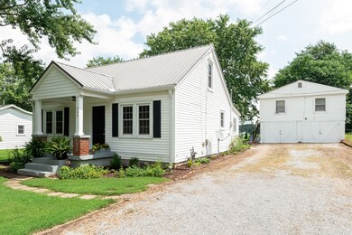 Cute cottage with a detached garage....