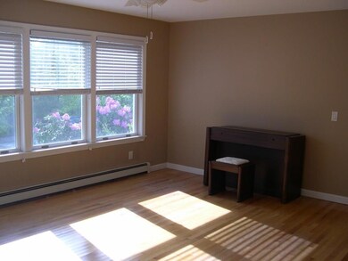 The sun filled living room is 17 X 13.