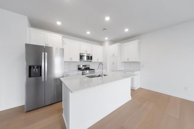 (Photo of a very similar home, actual finishes may vary)