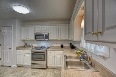 The kitchen has plenty of counter and cabinet space.