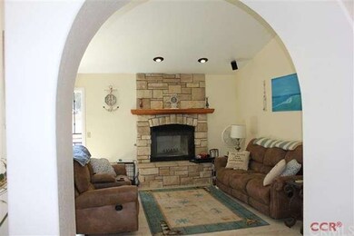 Family room with second fireplace, has corner shel