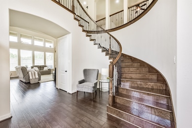 Beautiful Staircase with hardwood flooring