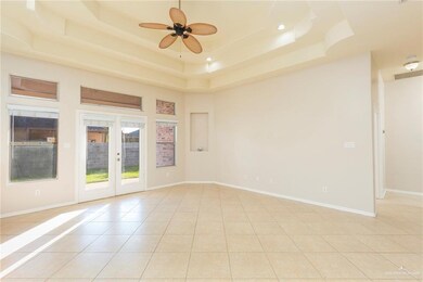 The windows and paneless French doors allow lots of natural light into the home.