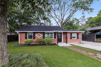 Ranch-style house with brick siding