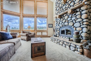 Living room featuring a high ceiling, carpet floor