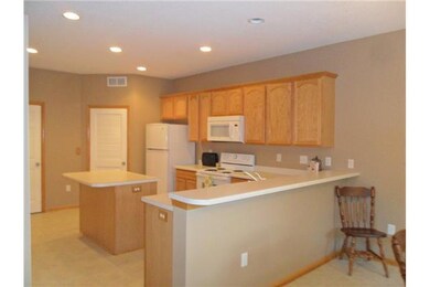 Kitchen. Ceramic Tile Floor, Oak Cabinets and Isla
