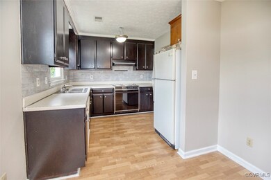 Kitchen featuring wall oven, white refrigerator, s