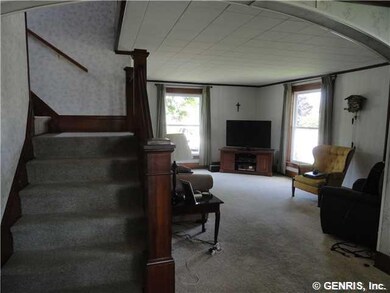 Living Room. Turned stairway at entry to living ro
