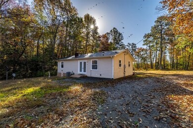 Back of property featuring central AC