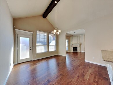 Unfurnished dining area with high vaulted ceiling,