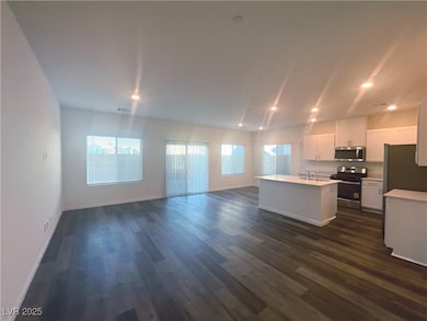 Living room with recessed lighting and luxury vinyl plank floors