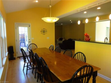 Eat-in kitchen with door leading to deck