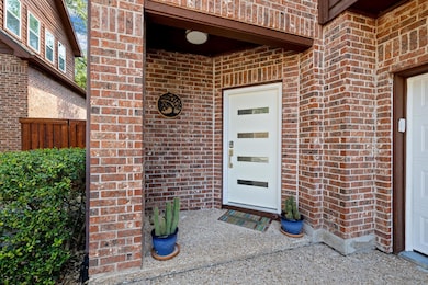 Property entrance with brick siding