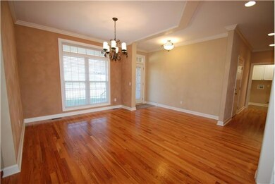 Formal dining room is open to the kitchen and family room. Flow and space are great for any size gathering.