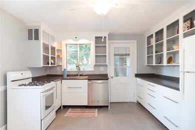 Updated kitchen with new lower cabinets, counterto