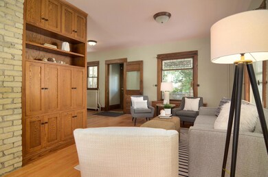 Custom cabinet off the living room hides a tv mount