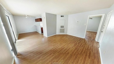 Empty room with light wood-type flooring, ceiling