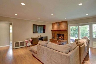 This open living space has new wood laminate floor