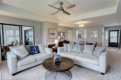 Living room featuring light colored carpet and cei