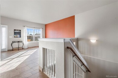 Front family room with tile floors and accent wall