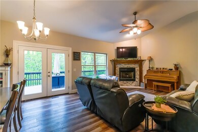 Natural light spills in through the large windows and door.