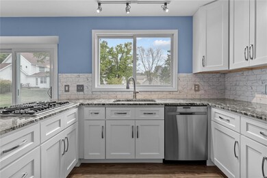 Abundant cabinetry and large window overlooking th
