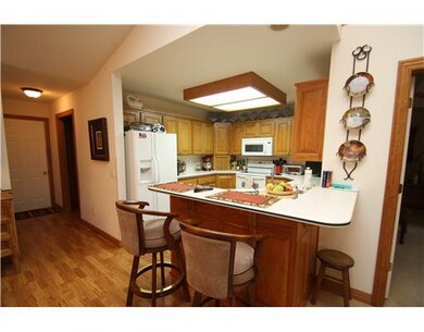 Kitchen. Just off this functional kitchen is a large laundry room with powder bath!